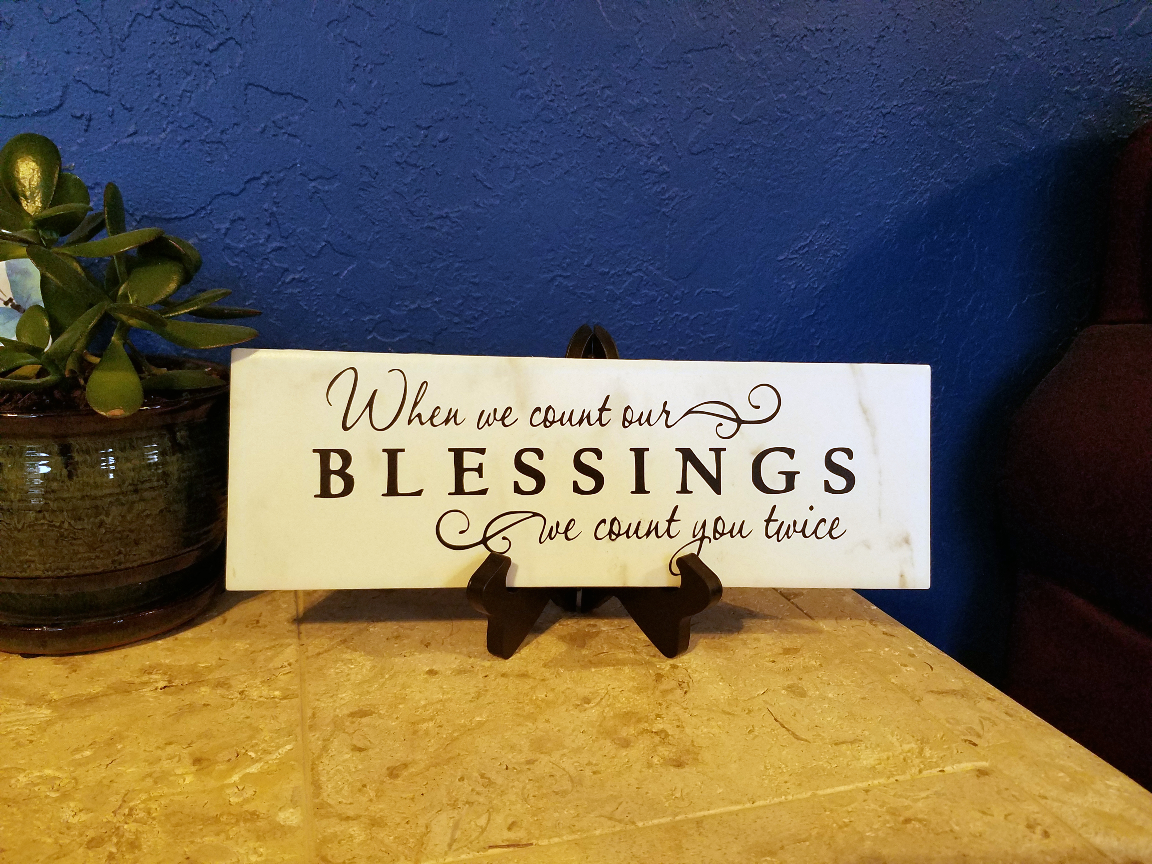 Custom Design By Custom Laser Art Designs.  It is a vinyl-cut quote placed on a decorative tile.  The saying is:  When We Count Our Blessings, We Count You Twice